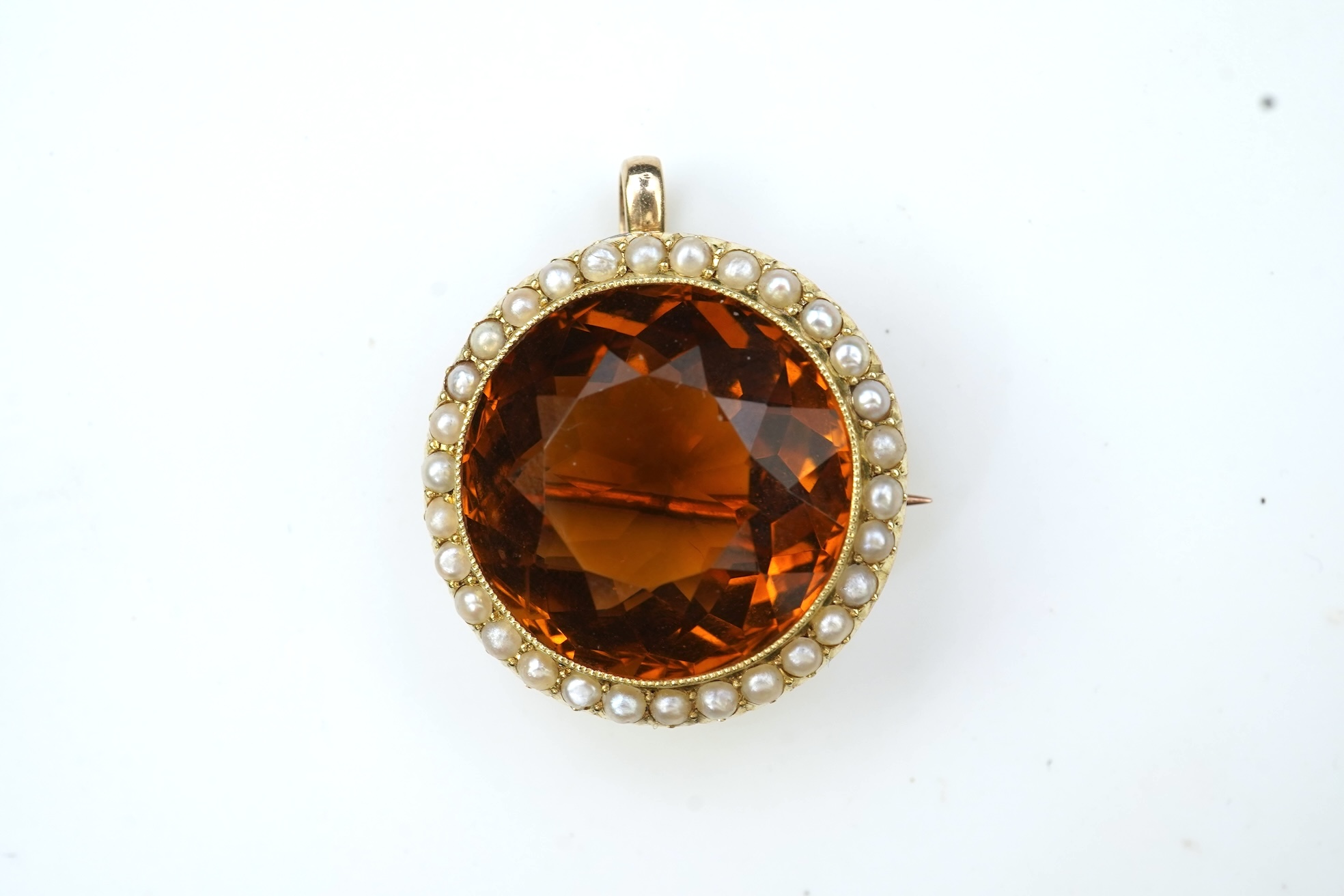 An Edwardian citrine and pearl brooch/pendant, early 20th century